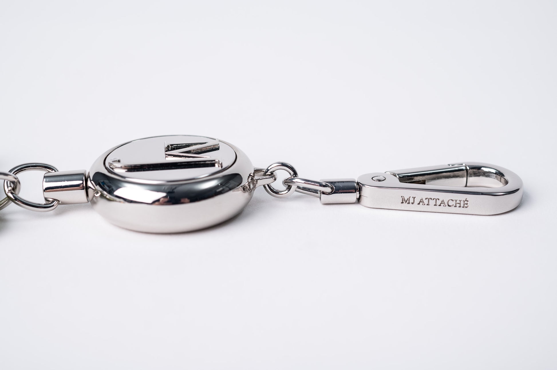 Silver Retractable Piece Clip Logo